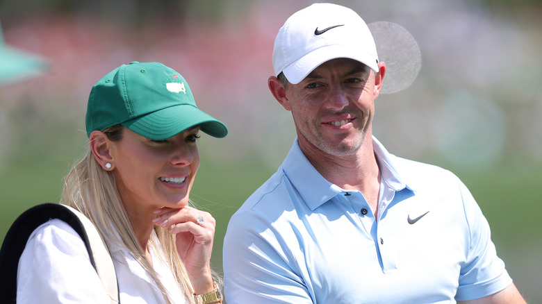 Erica Stoll caddying for Rory McIlroy