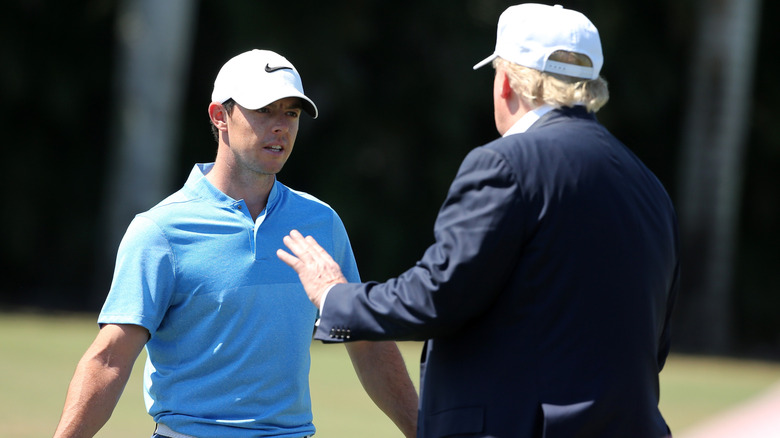 Rory McIlroy and Donald Trump playing golf
