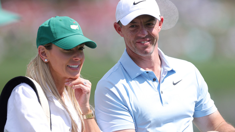 Rory McIlroy and Erica Stoll on the golf course