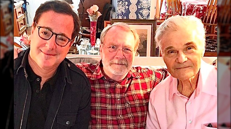 Bob Saget, Martin Mull, and Fred Willard seated on couch