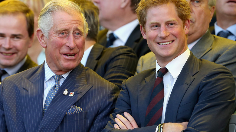 King Charles, Prince Harry posing