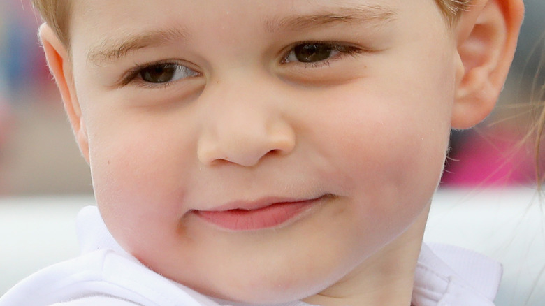 Prince George with a neutral expression