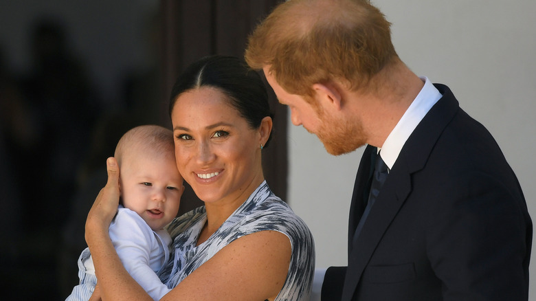 Prince Harry and Meghan Markle pose with Archie in 2019