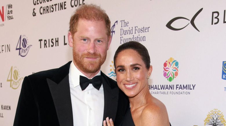 Prince Harry and Meghan Markle posing.