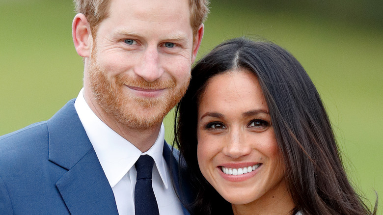 Prince Harry and Meghan Markle smiling