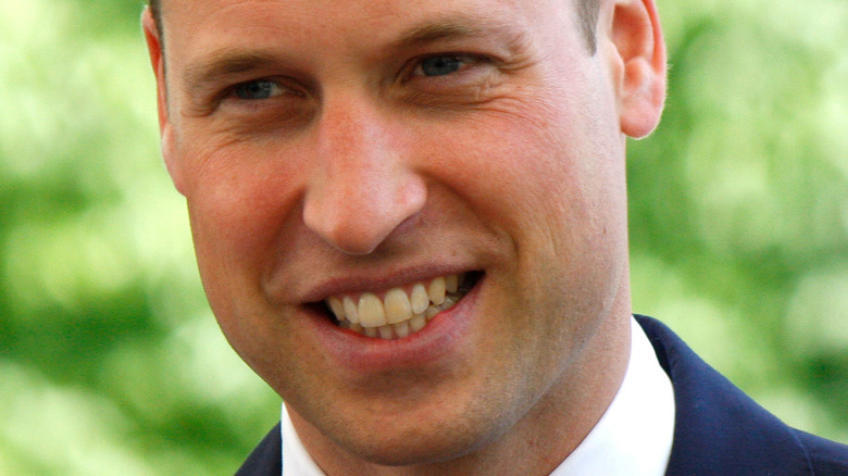 Prince William smiling slightly