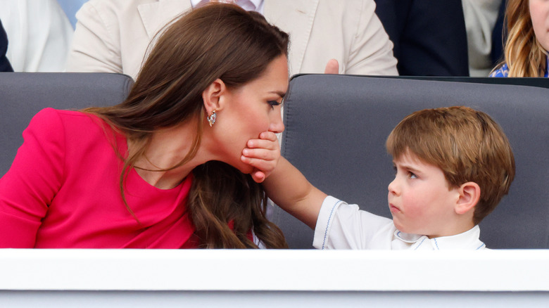 Prince Louis covering Kate Middleton's mouth
