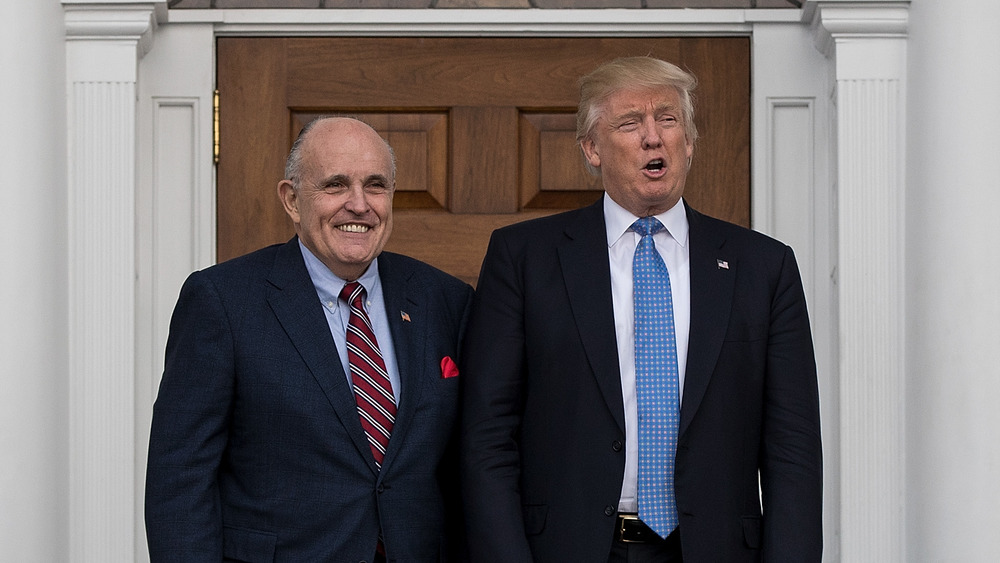 Rudy Giuliani poses with Donald Trump outside White House
