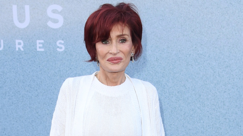 Sharon Osbourne posing on step-and-repeat