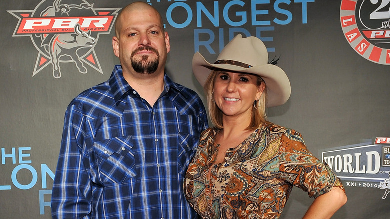 Brandi Passante and Jarrod Schulz smile on a 2014 red carpet