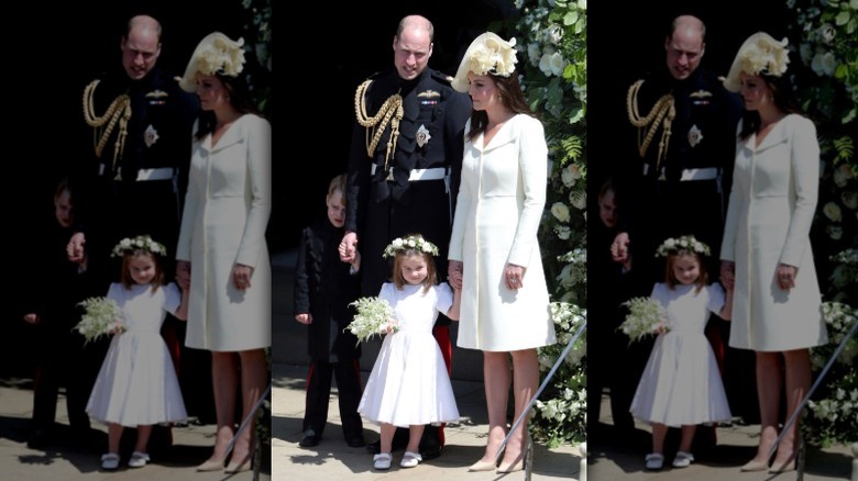 Kate Middleton and Prince William pose with Princess Charlotte at Meghan and Harry's wedding