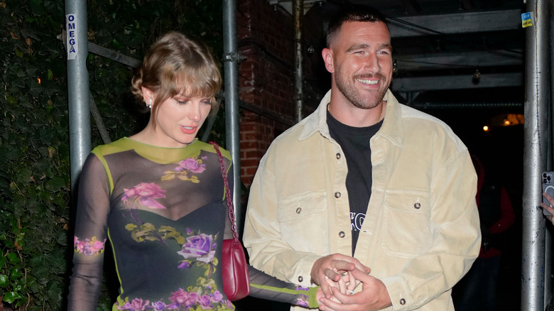 Taylor Swift, Travis Kelce holding hands