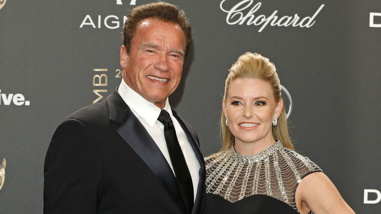 Arnold Schwarzenegger and Heather Milligan pose in 2017.