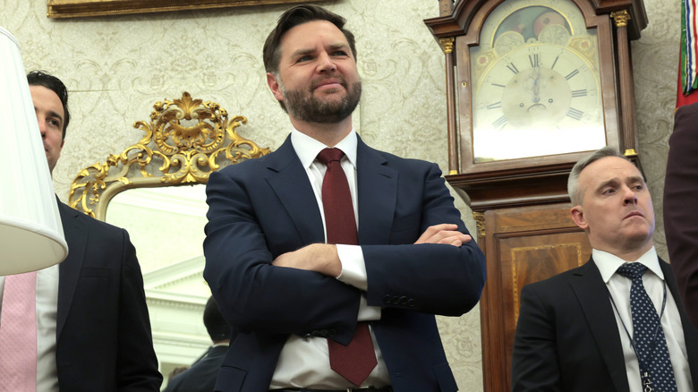 JD Vance in the oval office with his arms crossed