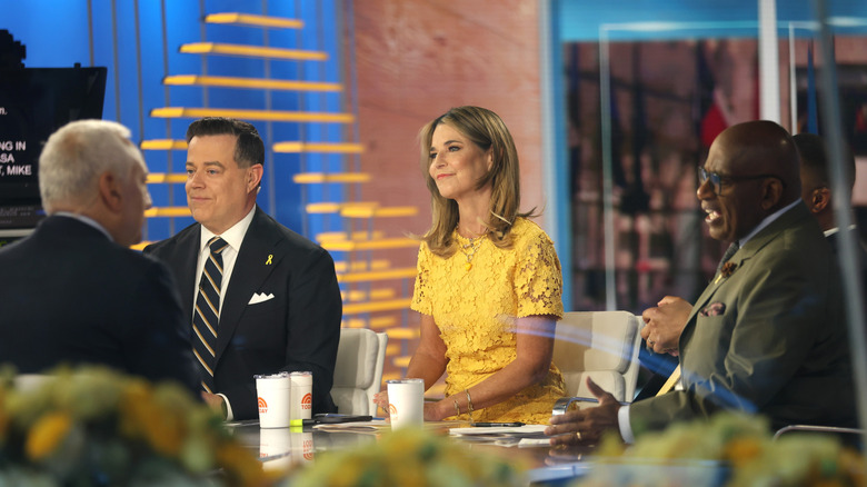 Carson Daly, Savannah Guthrie and Al Roker filming the "Today" show.
