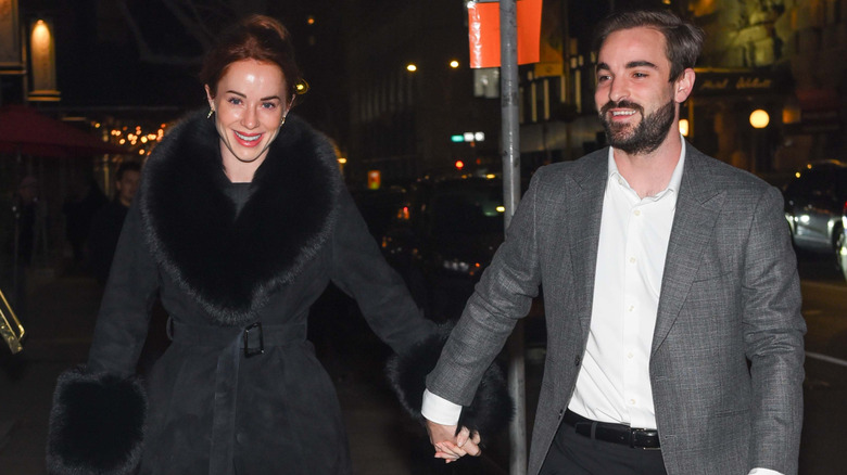 Whitney and Connor Leavitt hold hands New York City