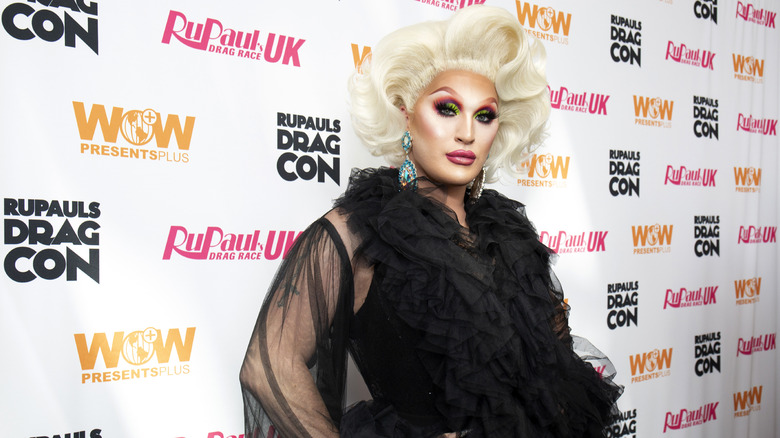 Drag queen The Vivienne wearing a black tulle frock