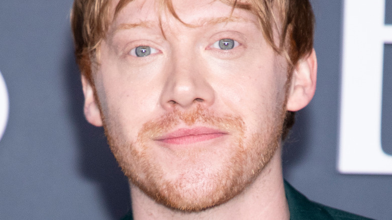 Rupert Grint posing on the red carpet