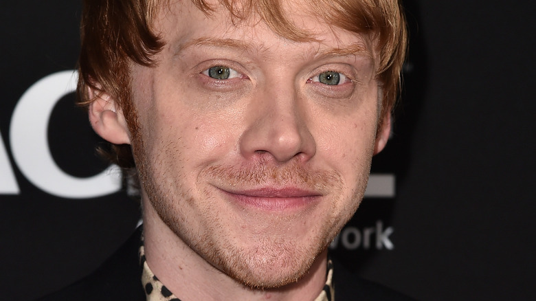 Rupert Grint poses in a leopard-print shirt