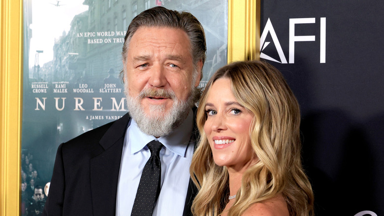 Russell Crowe and Britney Theriot pose in 2025