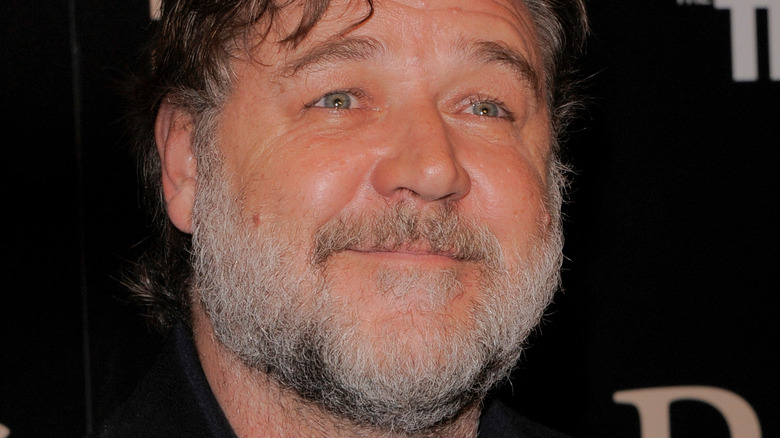 Russell Crowe smiling short gray beard