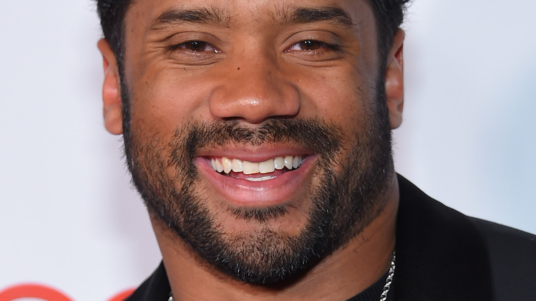 Russell Wilson smiling at an event