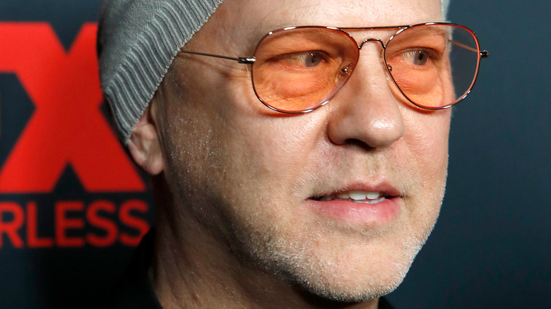 Ryan Murphy at an event wearing sunglasses and a beanie