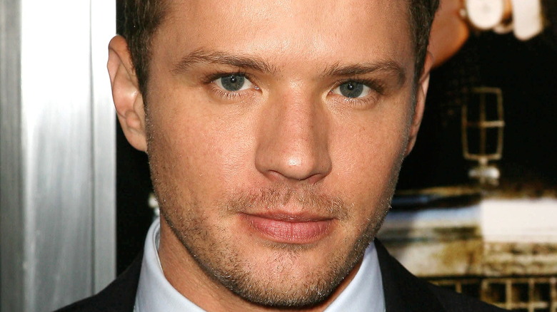 Ryan Phillippe stares intensely into the camera at an event