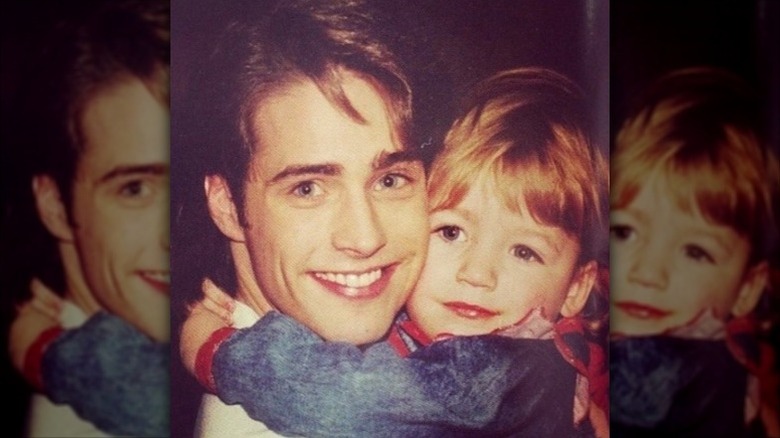 Blake Lively as a child poses with Jason Priestley