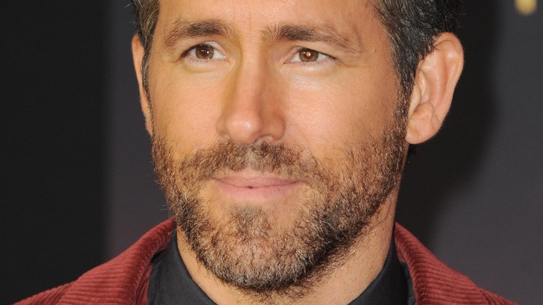 Ryan Reynolds posing at a movie premiere