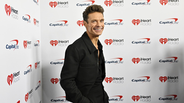 Ryan Seacrest posing in an all-black outfit at the 2026 iHeartRadio Music Festival.
