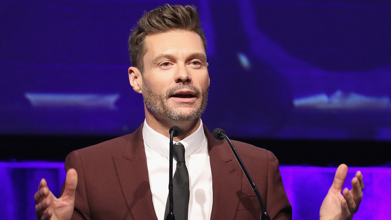 Ryan Seacrest accepting an award onstage during the 2019 Fashion Scholarship Fund Awards Gala