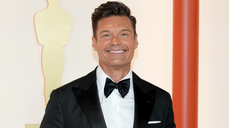 Ryan Seacrest attending Academy Awards