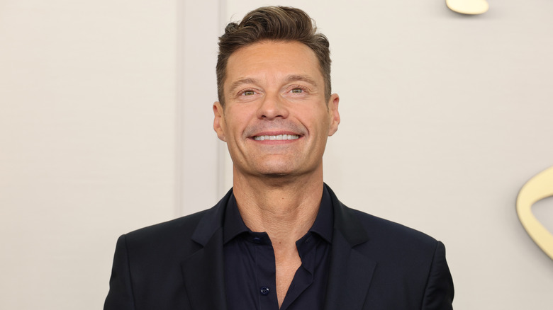 Ryan Seacrest smiling with teeth