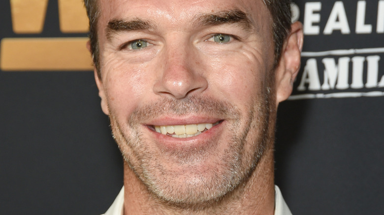 Ryan Sutter smiling at an event