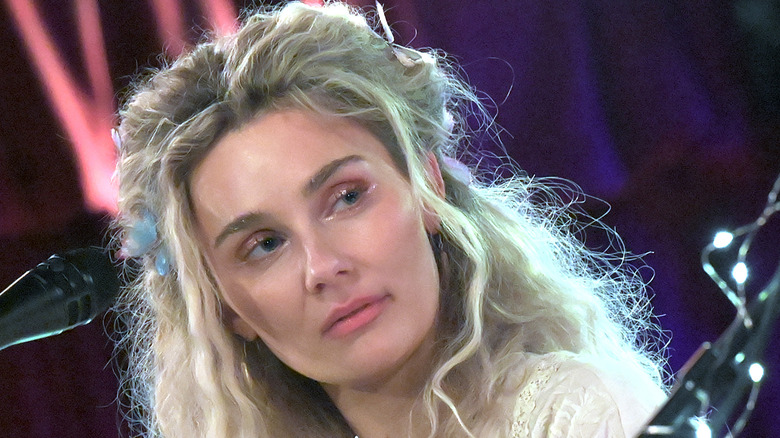 Clare Bowen pinned back hair looking sad