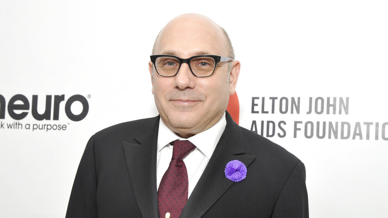 Willie Garson wearing a black suit 