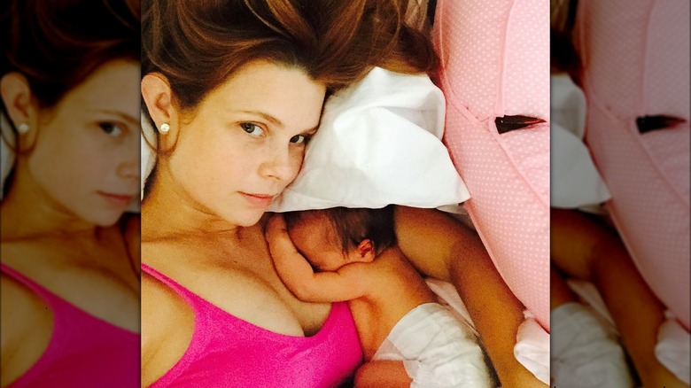 JoAnna Garcia Swisher holding her daughter