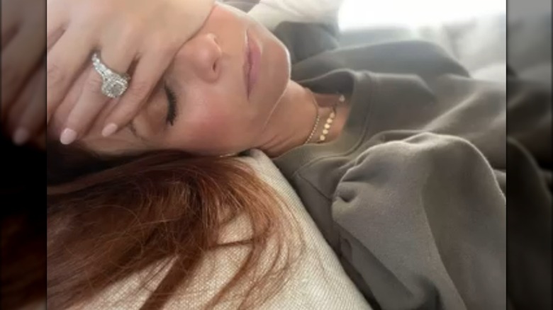 JoAnna Garcia Swisher with hand on face