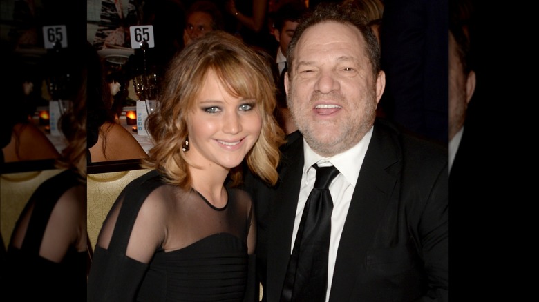 Jennifer Lawrence smiling, Harvey Weinstein laughing