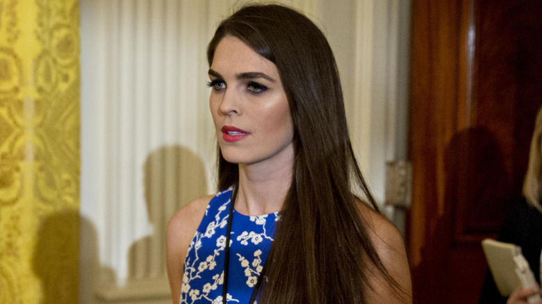 Hope Hicks in a bright blue dress