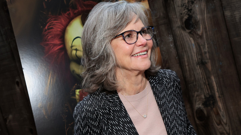Sally Field smiling and wearing glasses on the red carpet