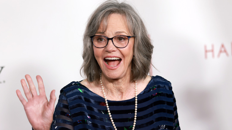 Sally Field waving on the red carpet