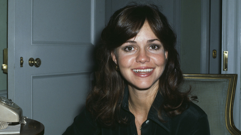 Sally Field smiling while wearing her long hair in the '70s