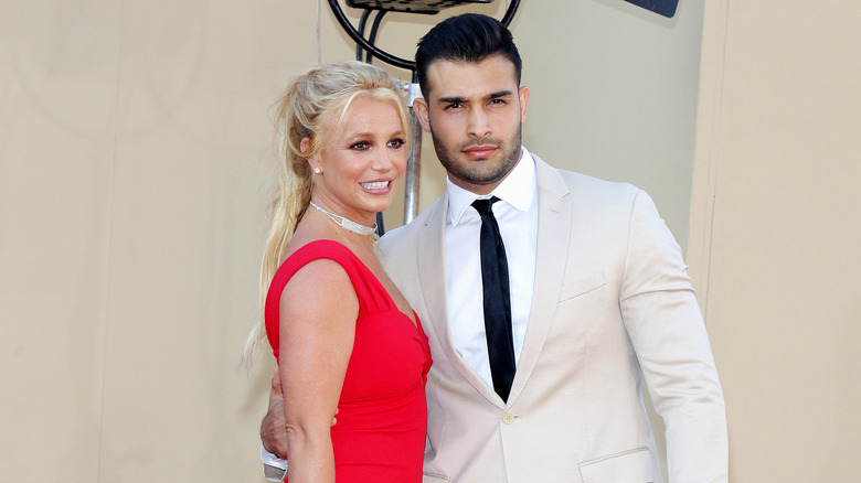 Sam Asghari and Britney Spears pose 