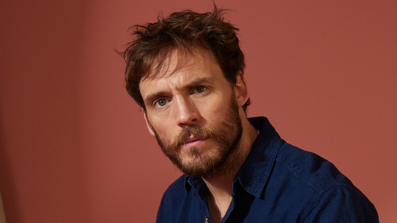 Sam Claflin posing serious