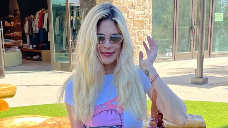 Cleo Rose Elliott poses in a pink sunglasses