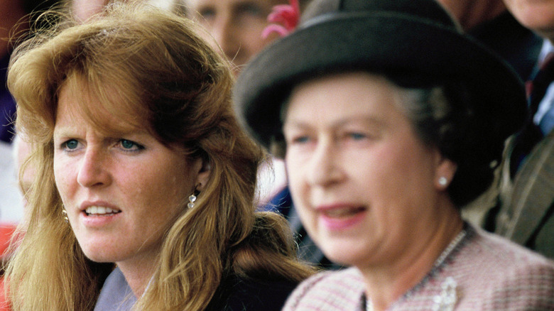 Sarah Ferguson frowning beside Queen Elizabeth
