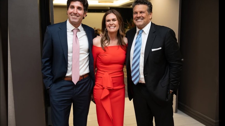 Sarah Huckabee Sanders in a red dress