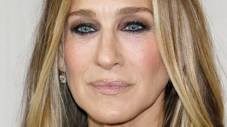 Sarah Jessica Parker smiles solemnly at an event